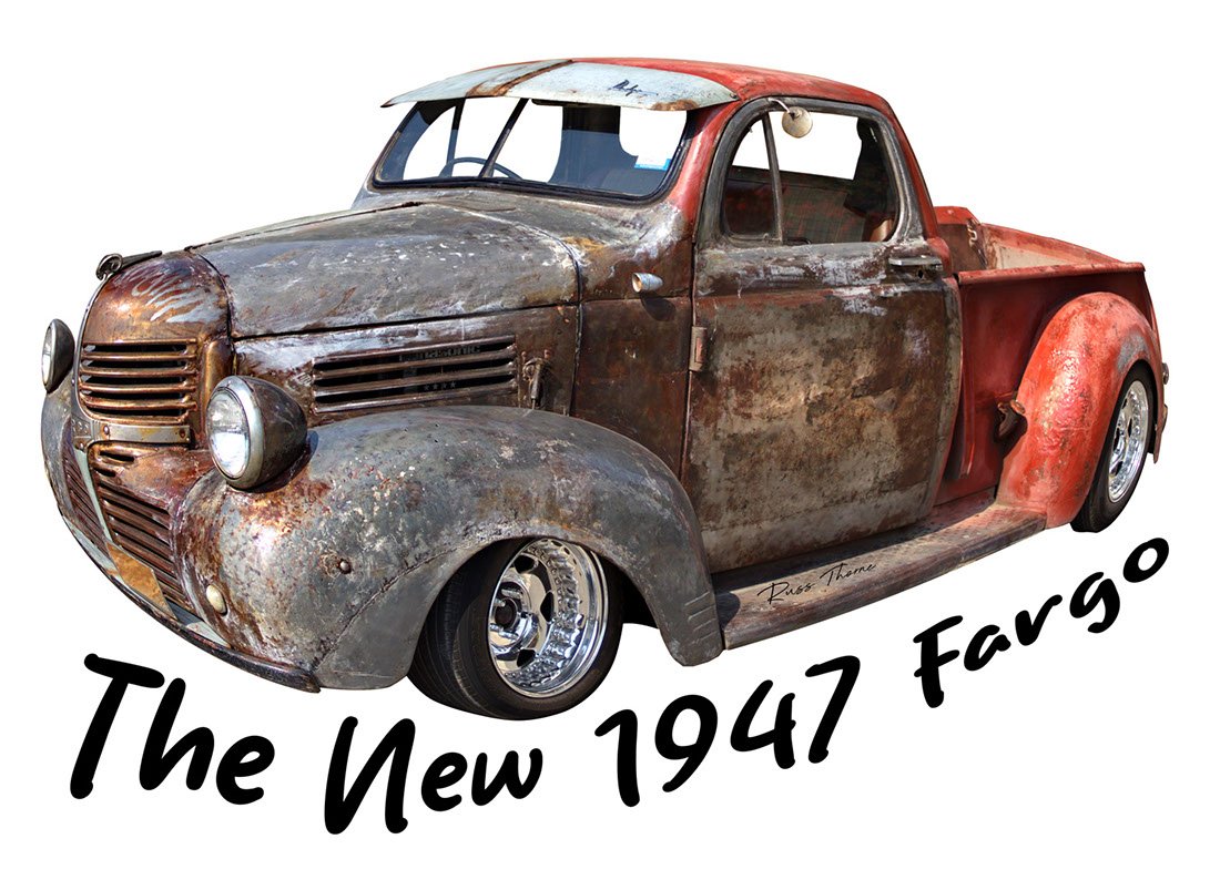 A beautifully fully restored 1940s Chevrolet sedan on display at a car show, reflecting its vintage elegance.