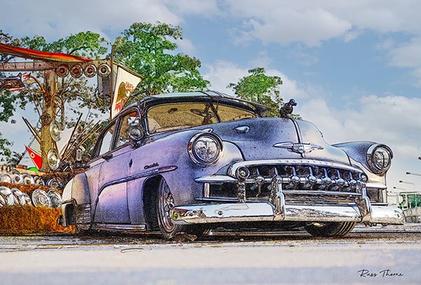 A beautifully fully restored 1940s Chevrolet sedan on display at a car show, reflecting its vintage elegance.