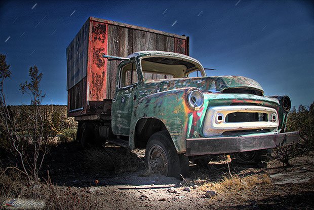Near Mojave California, an old truck used as a bill board. photo by Russ Thorne