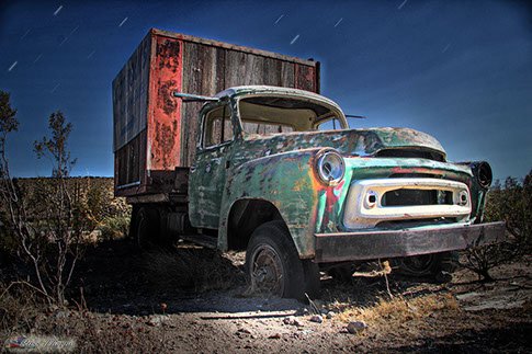 Near Mojave California, an old truck used as a bill board. photo by Russ Thorne